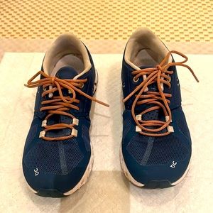 OC on cloud on running blue sneakers, unique tan laces, good condition.